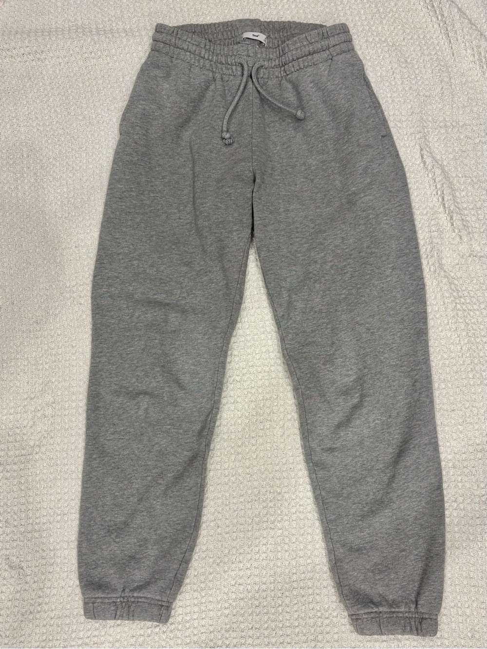 TNA Cozy Sweatpants with side pockets and ankle cuffs
